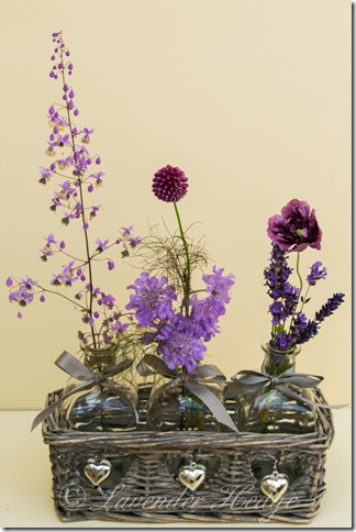 Purple Flower Arrangement Flower arrangement in bottles
